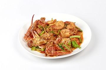 Stir-fried crab and shrimp in curry power is top-ten of popular Thai food as seafood to fried with  fresh milk ,grill curry ,egg ,oyster oil and yellow curry power. 