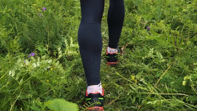 Running Legs Close up With Sunset Slow Motion. Beauty image of running man legs in slow motion on landscape track, ultra trail