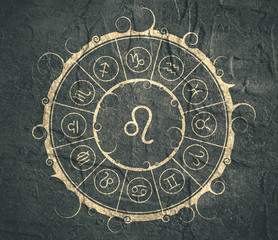 Astrological symbols in the circle. Concrete wall textured. Lion sign