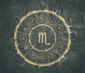 Astrological symbols in the circle. Concrete wall textured Scorpion sign