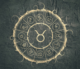 Astrological symbols in the circle. Concrete wall textured Bull sign