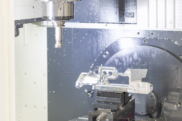 The CNC machine while prepare cutting sample work piece.The Vertiacal Milling CNC machine with indexable cutting tool and sample work piece.