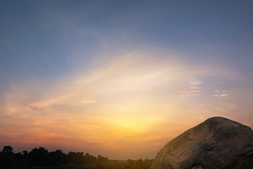 Beautiful sunset landscape with stone conceptual scene