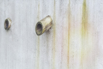 Ventilation pipes on the wall.