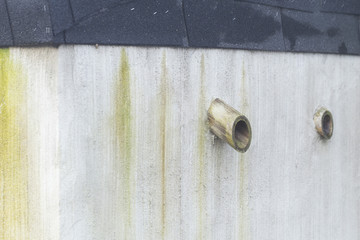 Ventilation pipes on the wall.