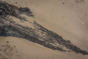 Old Black Timber on the Beach, Chanthaburi, Thailand.