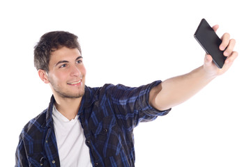 Young man taking a selfie with his smartphone.