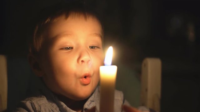 Little Boy Blows Out Candle.