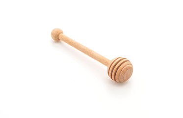 wooden honey stick on white