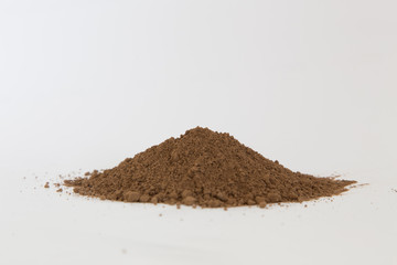 Pile of  brown  soil on white background