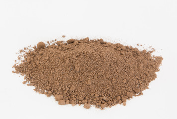 Pile of  brown  soil on white background