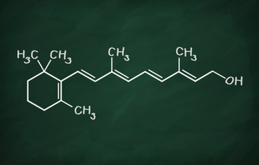 Structural model of Vitamin A1 (retinol) on the blackboard.
