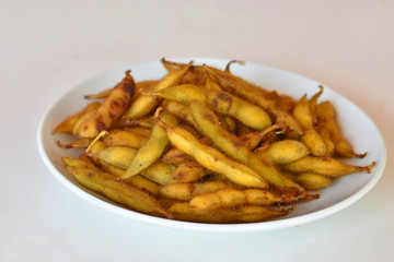 Soybeans in dish white.