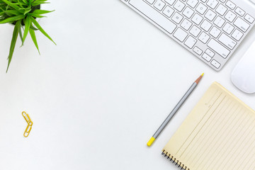 Modern working Place on White Office Desk with yellow