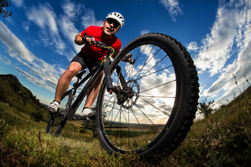 Fototapeta na wymiar Mountain Bike cyclist riding single track outdoor
