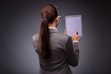 Naklejka premium Woman with tablet computer in business concept