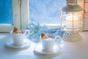 Tasty and sweet two gingerbread man in cocoa for Christmas