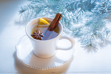Obraz na płótnie Canvas Tasty and sweet tea with cinnamon for Christmas