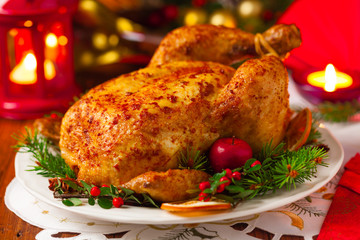 Roasted whole chicken with Christmas decoration.