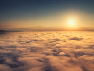 Fototapeta na wymiar Flying above the clouds