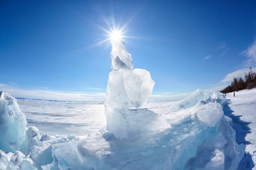 Ice floe and sun on winter Baikal lake