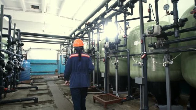 boiler heating system inspection. boiler maintenance or gas equipment at the plant. Modern pipes intertwined, and consortium, technologically. Perhaps the oil derrick. Work turns the pipe valve