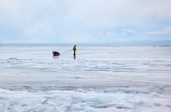 Tourist traveling on Baikal Lake in Siberia at winter