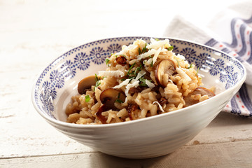 Tasty rice and mushrooms dish topped with cheese