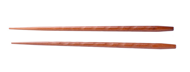Wooden pairs of chopsticks on white background