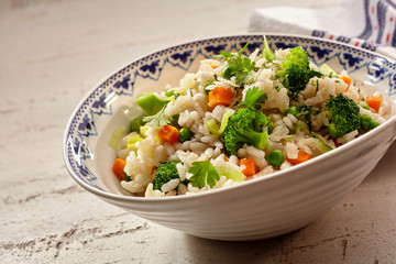 Savory risotto broccoli, carrots and parsley with rice