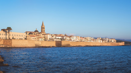 Fototapeta na wymiar View of the Historical Center of Alghero City from the Sea, Province of Sassari, Sardinia, Italy