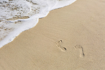 Footprints in the sand at the beach