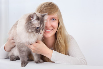 young woman with ragdoll cat