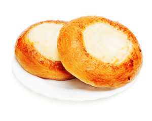 Fresh buns muffins with cottage cheese for breakfast isolated on white background.