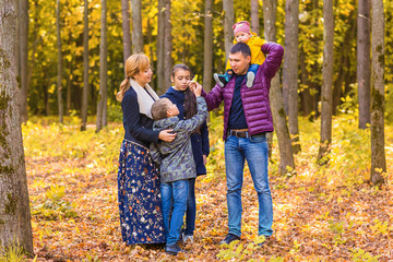 Portrait Of Happy Family on autumn nature