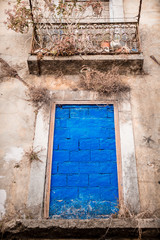 walled door with cement and painted in  blue- old building