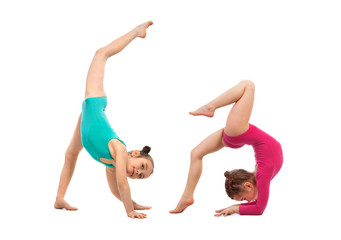 Flexible kids gymnasts doing acrobatic feat, isolated on white background