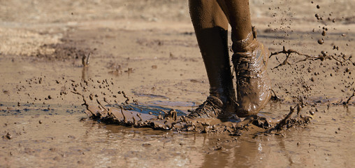 Mud race runners,detail of the legs