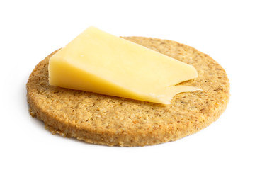 Single Scottish oatcake with a slice of yellow cheese.