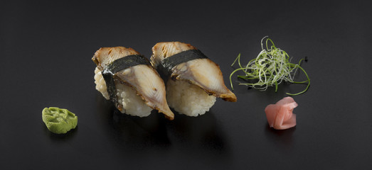 sushi nigiri over black background