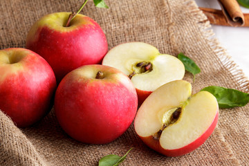 group of red apples with leaves