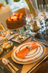 luxury table setting with a birthday cake selective focus