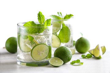 fresh mojito cocktail with fresh limes, mint, and ice
