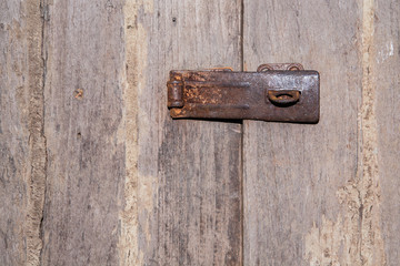 old rusty fasteners holding doors in rural houses