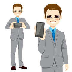 Young attractive businessman displaying smartphone on horizontal and vertical position