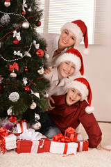 Mom and children in santa hats