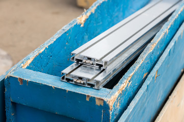 aluminum structural parts in wooden box