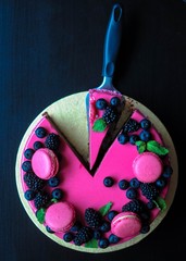 Delicious cake with fresh strawberries, raspberries, blueberry, currants. cut piece of cake and...