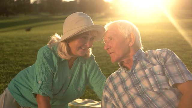 Senior man talking to woman. Elderly couple is smiling. You keep surprising me. Value of feelings.