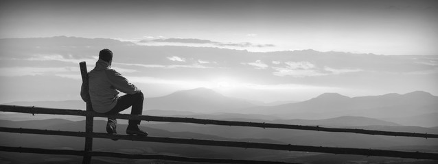 Enjoy sunrise in mountain valley. Monochrome colors